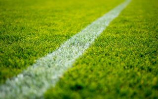 Image of football field - Photo by Peter Glaser on Unsplash